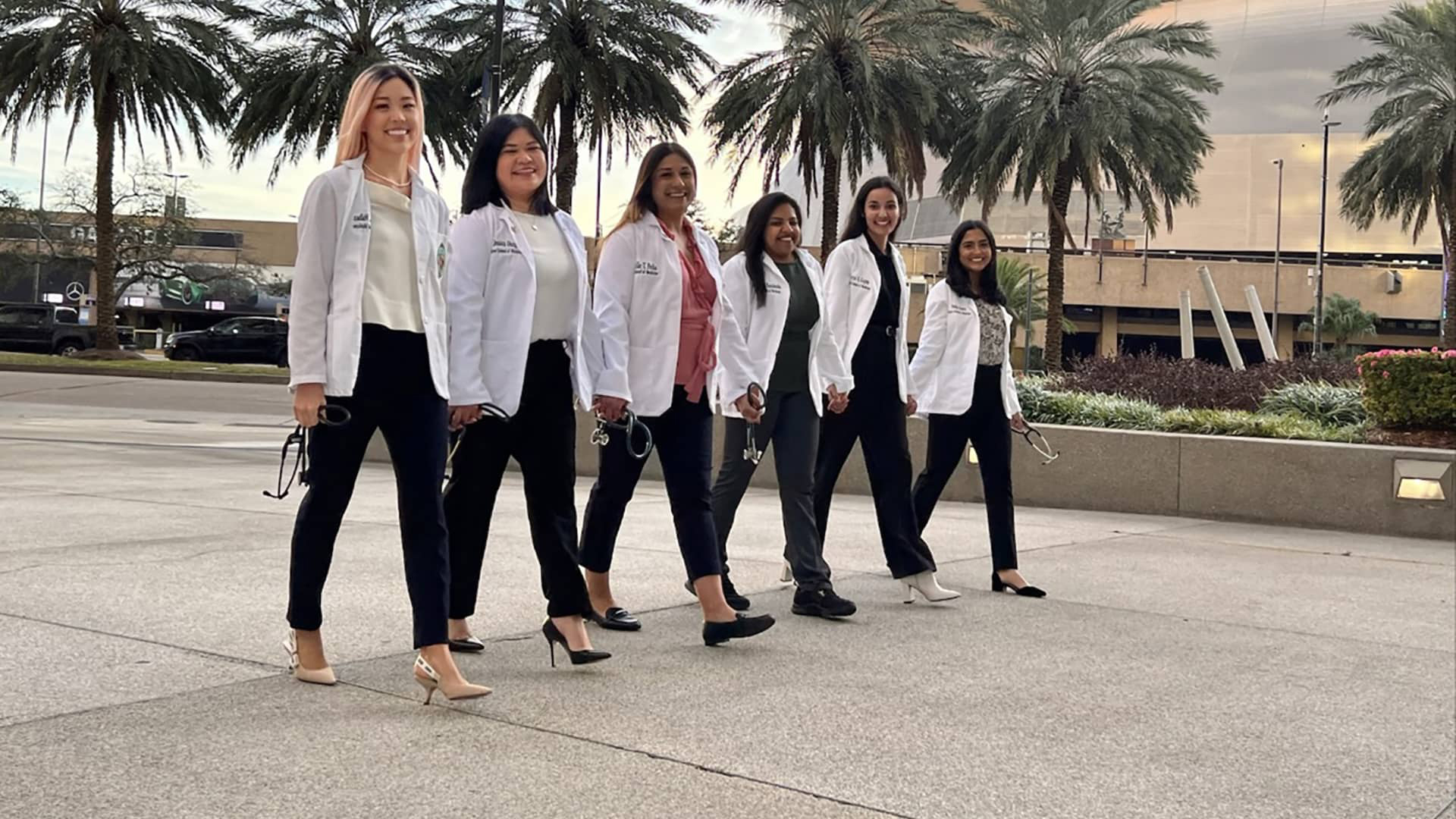 Med students walking in their white jackets