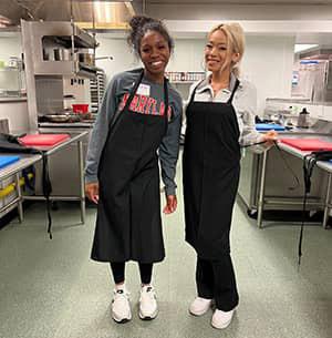 workers pose in Goldring Center kitchen