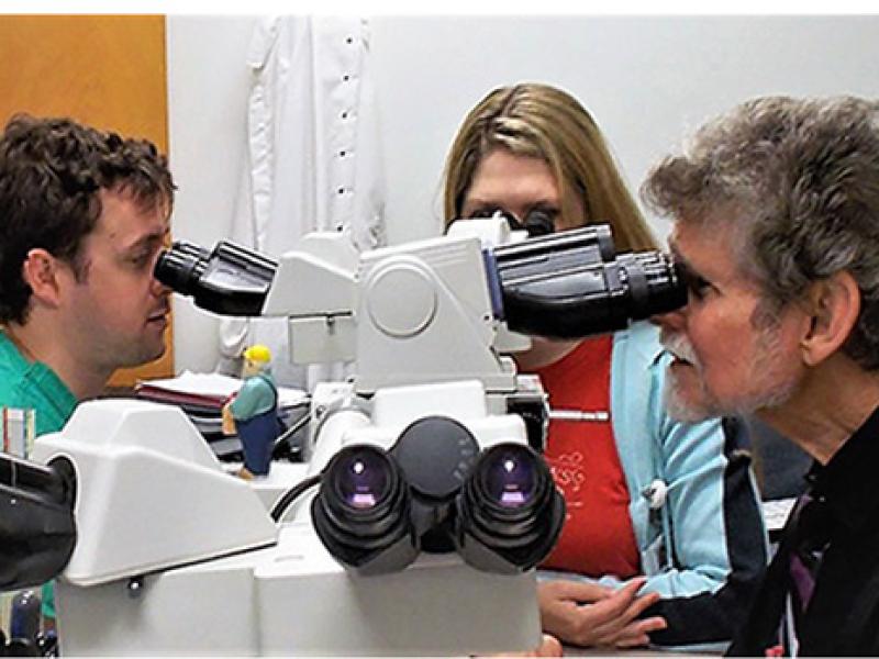 Dr. Daroca at Microscope