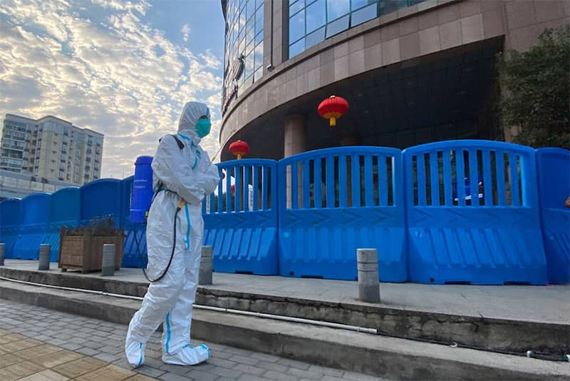 Chinese worker disinfects outside of Central Hospital in Wuhan