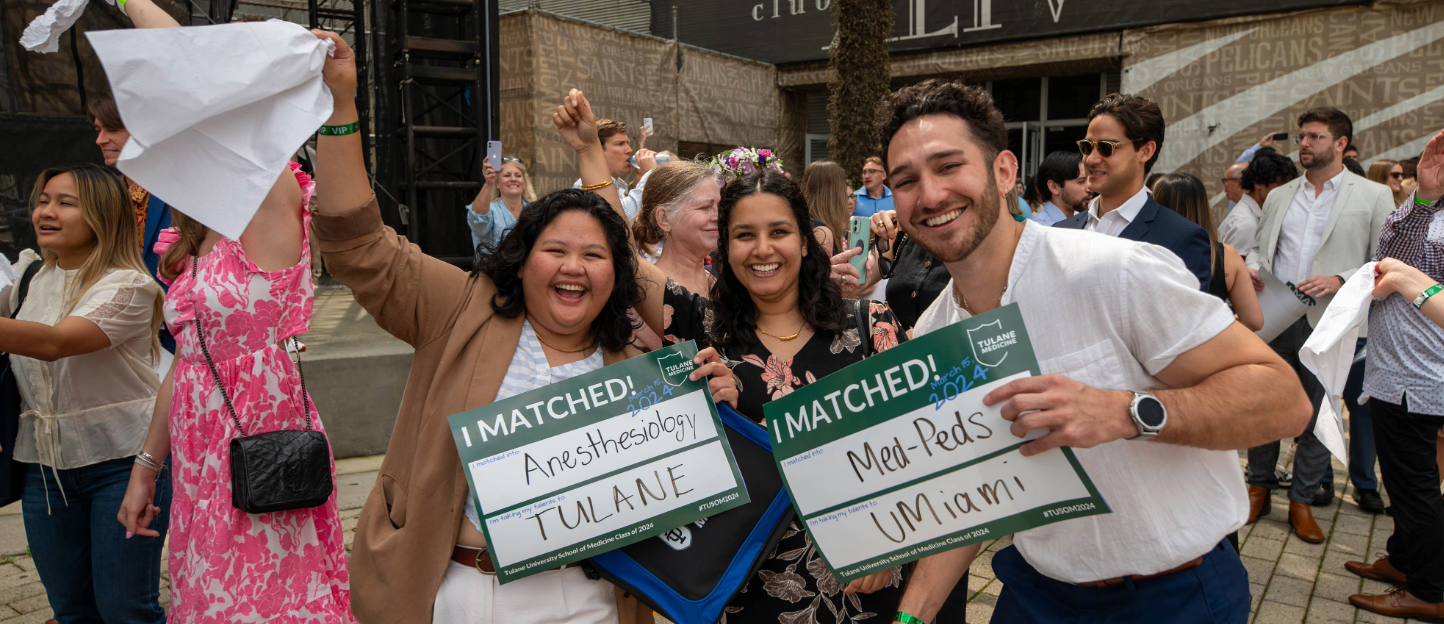 This photo shows medical students holding their Match Day signs