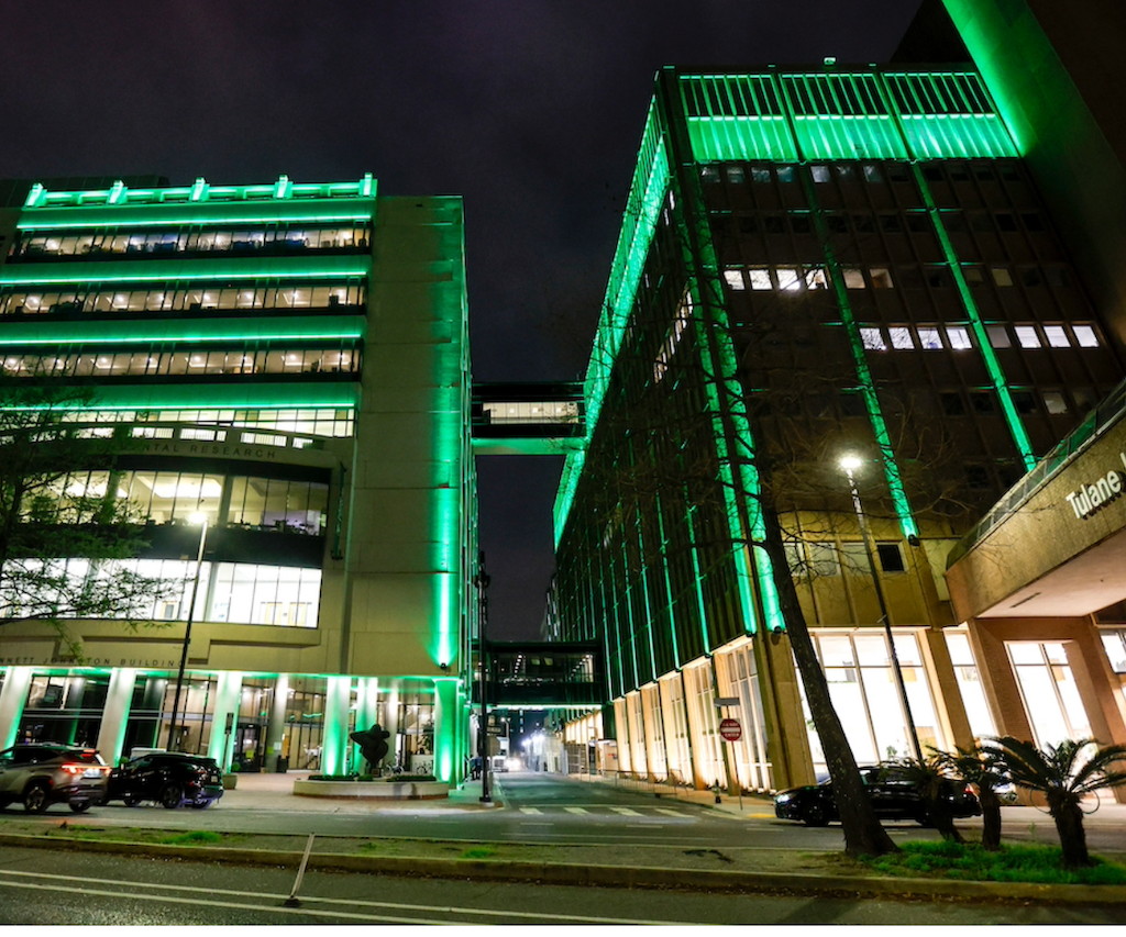 This is a photo of the JBJ and Hutchinson buildings light up with green lights