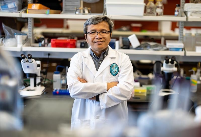 This is a photo of a person standing in a lab