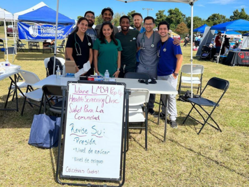 This photo shows Tulane LMSA students hosting a free clinic at a festival