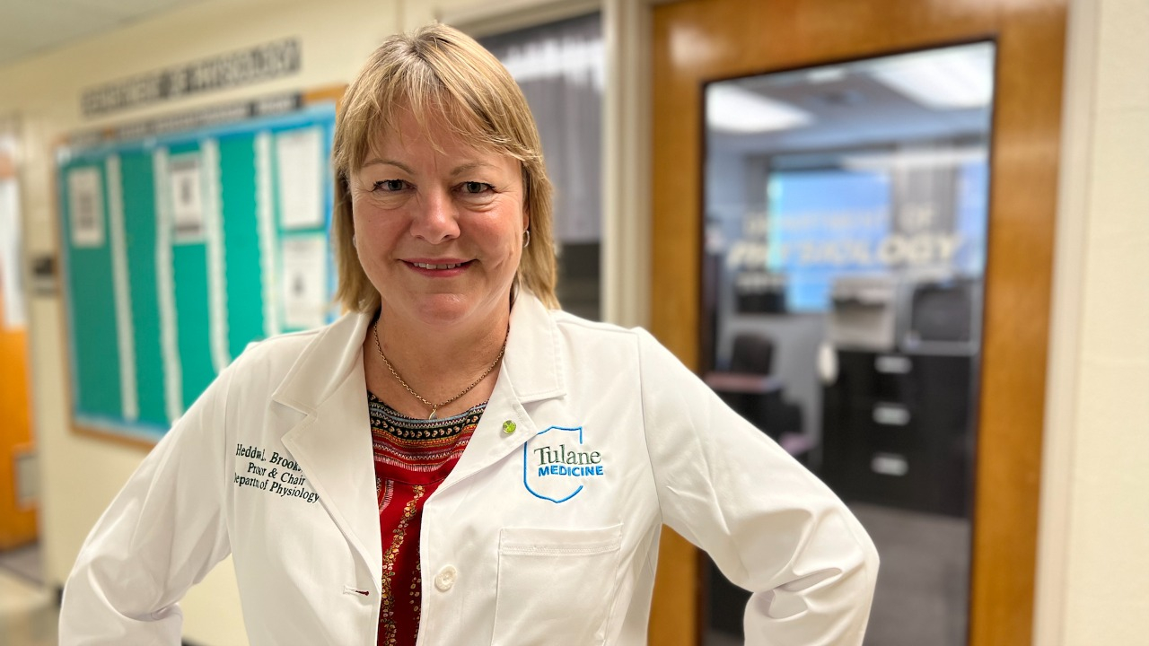 Heddwen Brooks This is an image of a woman in a white lab coat.