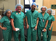 group picture of doctors in operating room