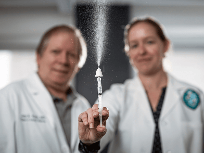 Drs. Jay Kolls & Elizabeth Norton working on nasal vaccine in the lab