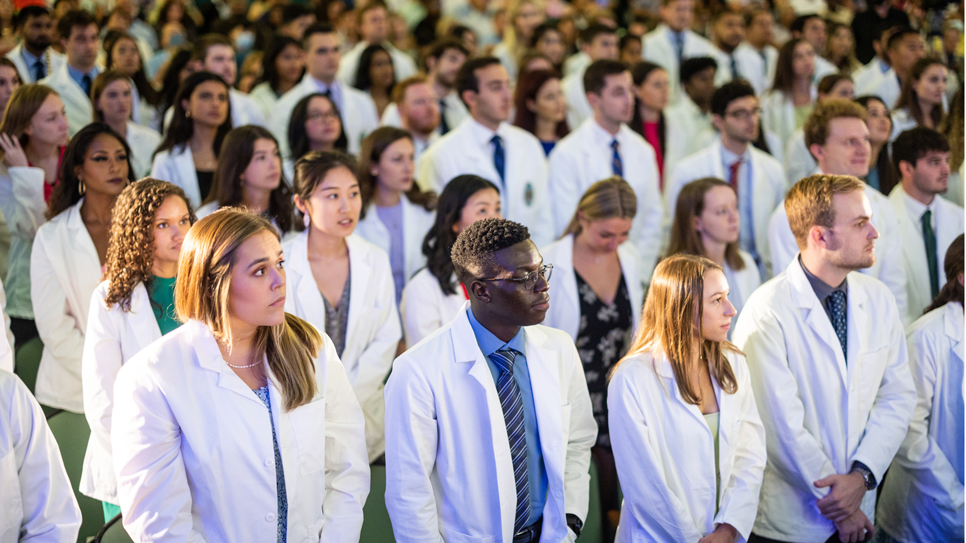 student group standing at white coat ceremony