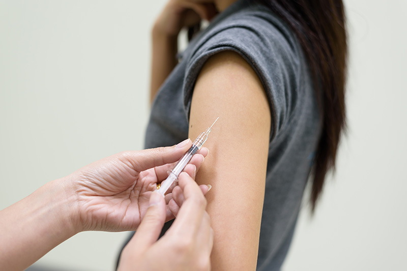 women getting a vaccination shot