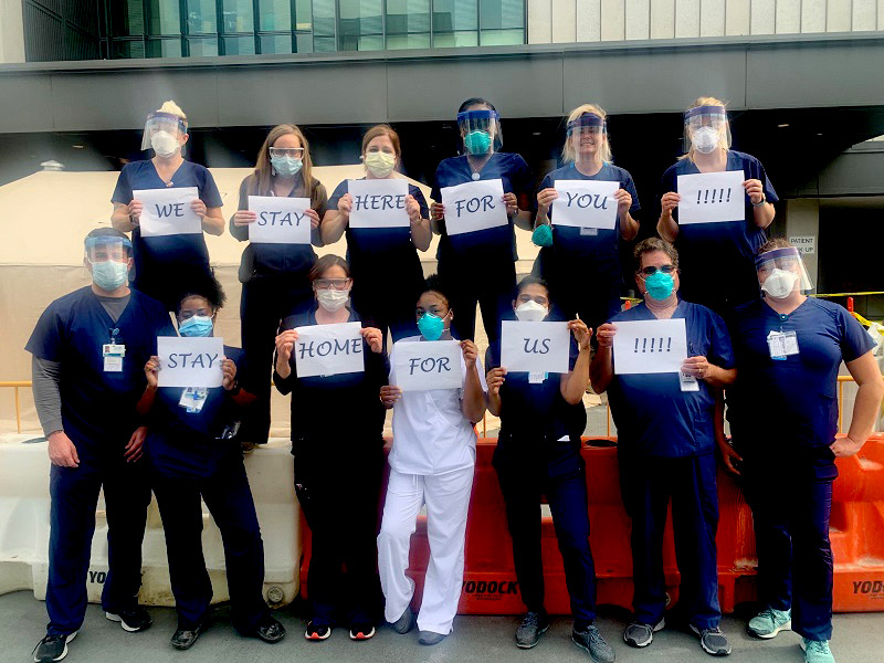 group of doctors & nurses outside hospital during COVID-19 pandemic