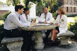 doctors in conversation sitting outside 