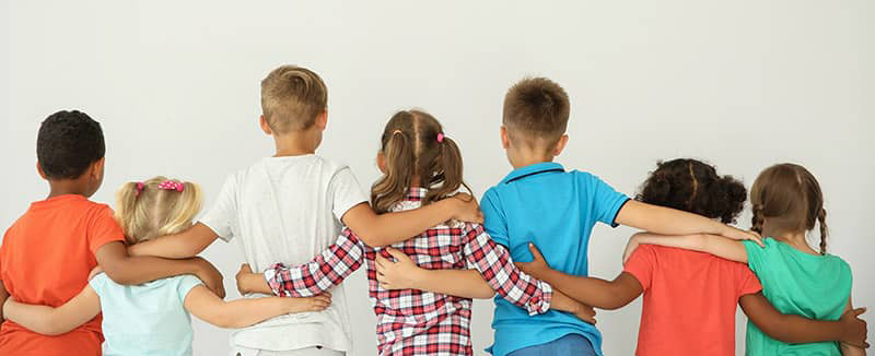 young children hugging each other
