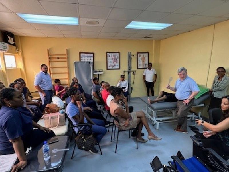 This picture shows a group of people in a classroom