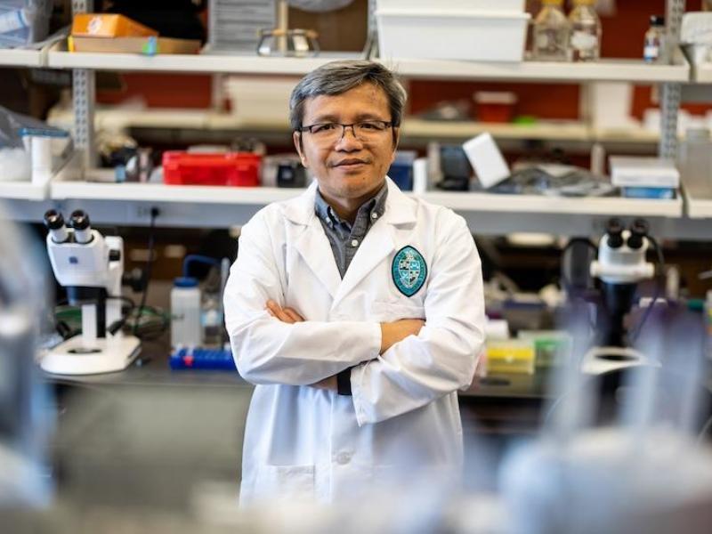 This is a photo of a person standing in a lab