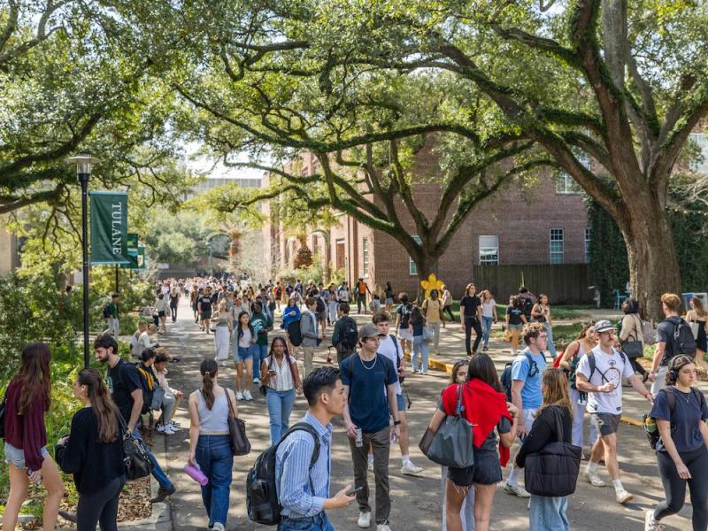 People walk around the uptown campus 