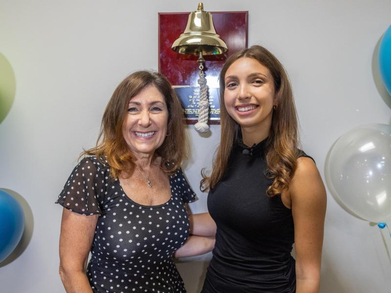  Isabella Spar & Wendy Jeshion stand in front of the donated bell