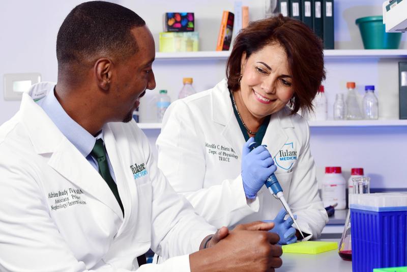Two Tulane researchers discuss matters in their lab