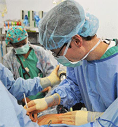 Doctors performing surgery on a patient