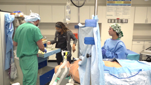 Anesthesiology Fellows at Sim Center This shows a group of people in a simulation room