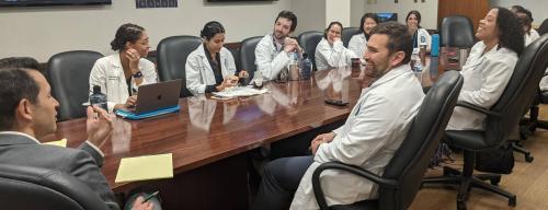 conference room a group of doctors laughing