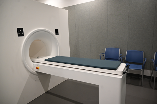 MRI simulator with blue chairs in the background