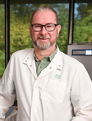 Andrew Maclean profile picture, man in glasses and a lab coat