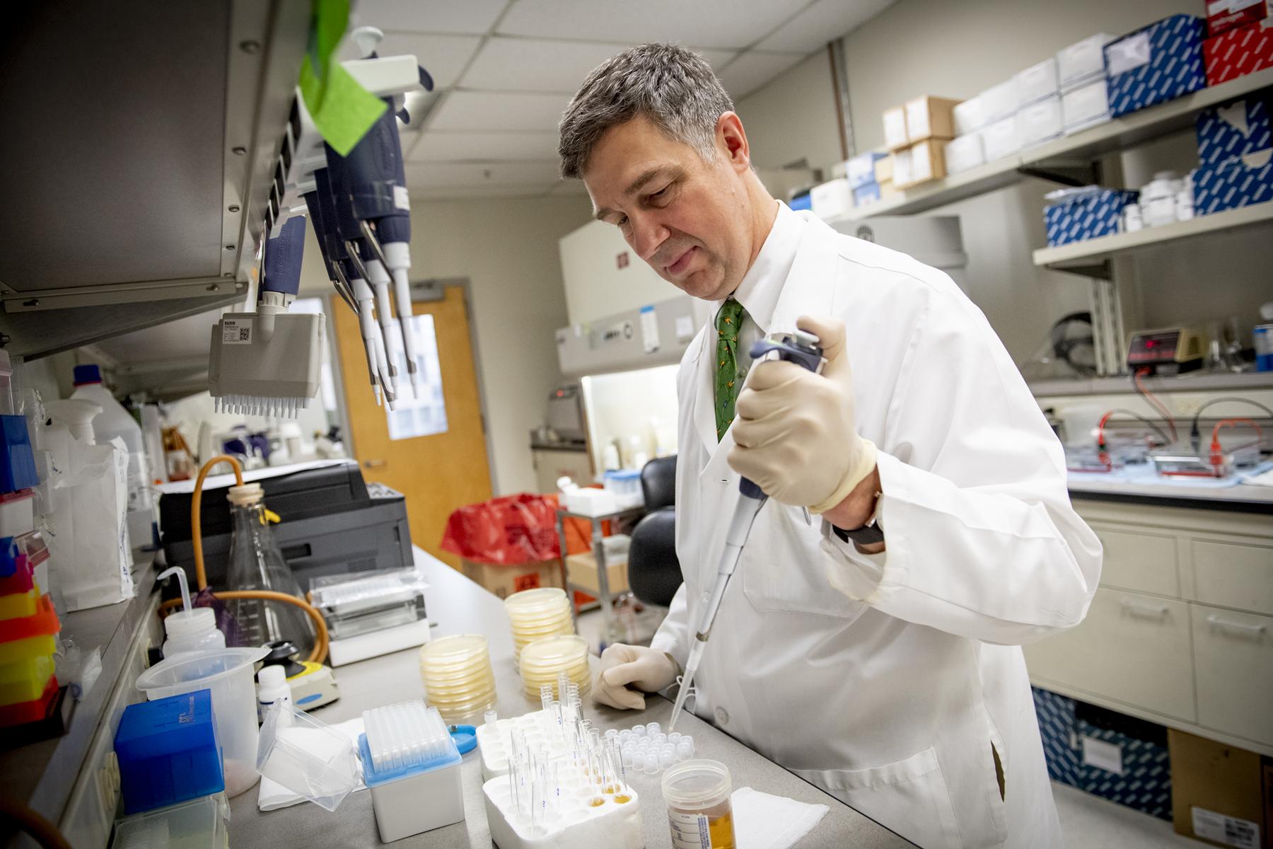 This shows a scientist working in a lab