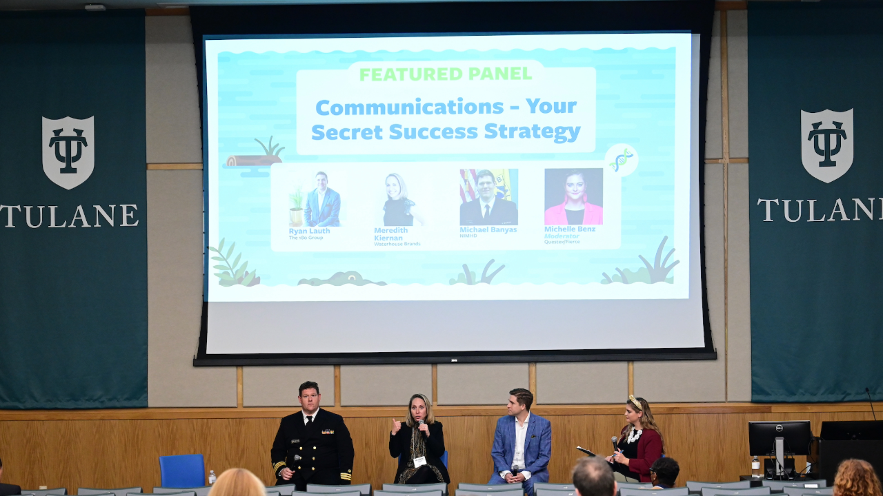 This is a photo of people presenting a session on communications at a conferece.