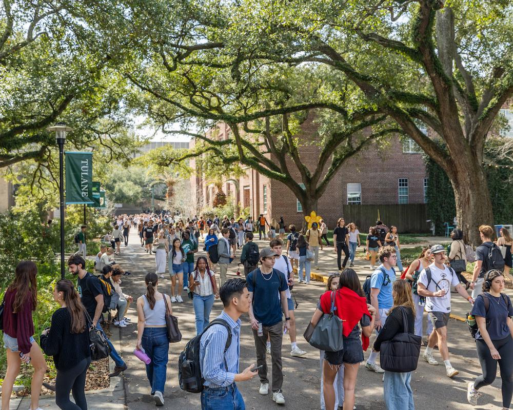 People walk around the uptown campus 