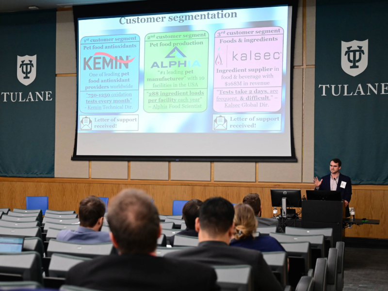 A person presents at a podium