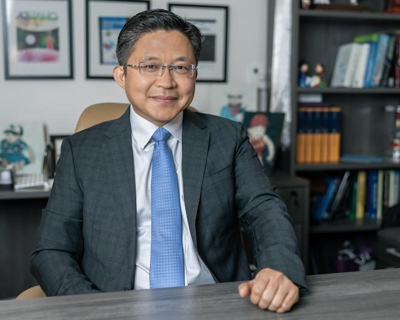 Tony Hu sitting at a desk