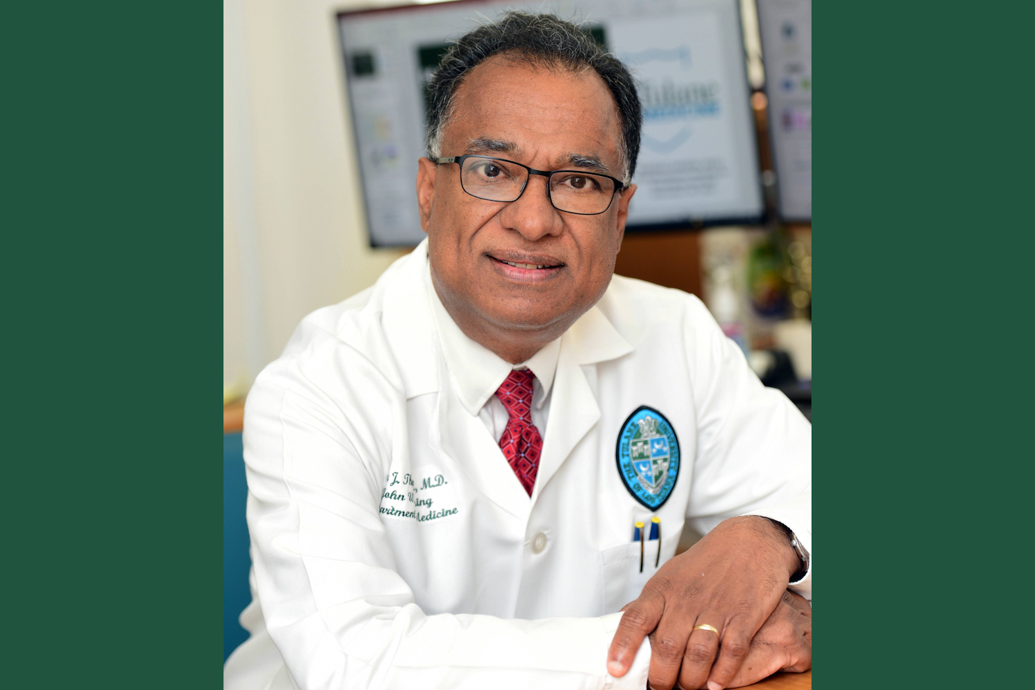 a banner image of Dr. Thannickal with green on the sides of the photo to make it wider